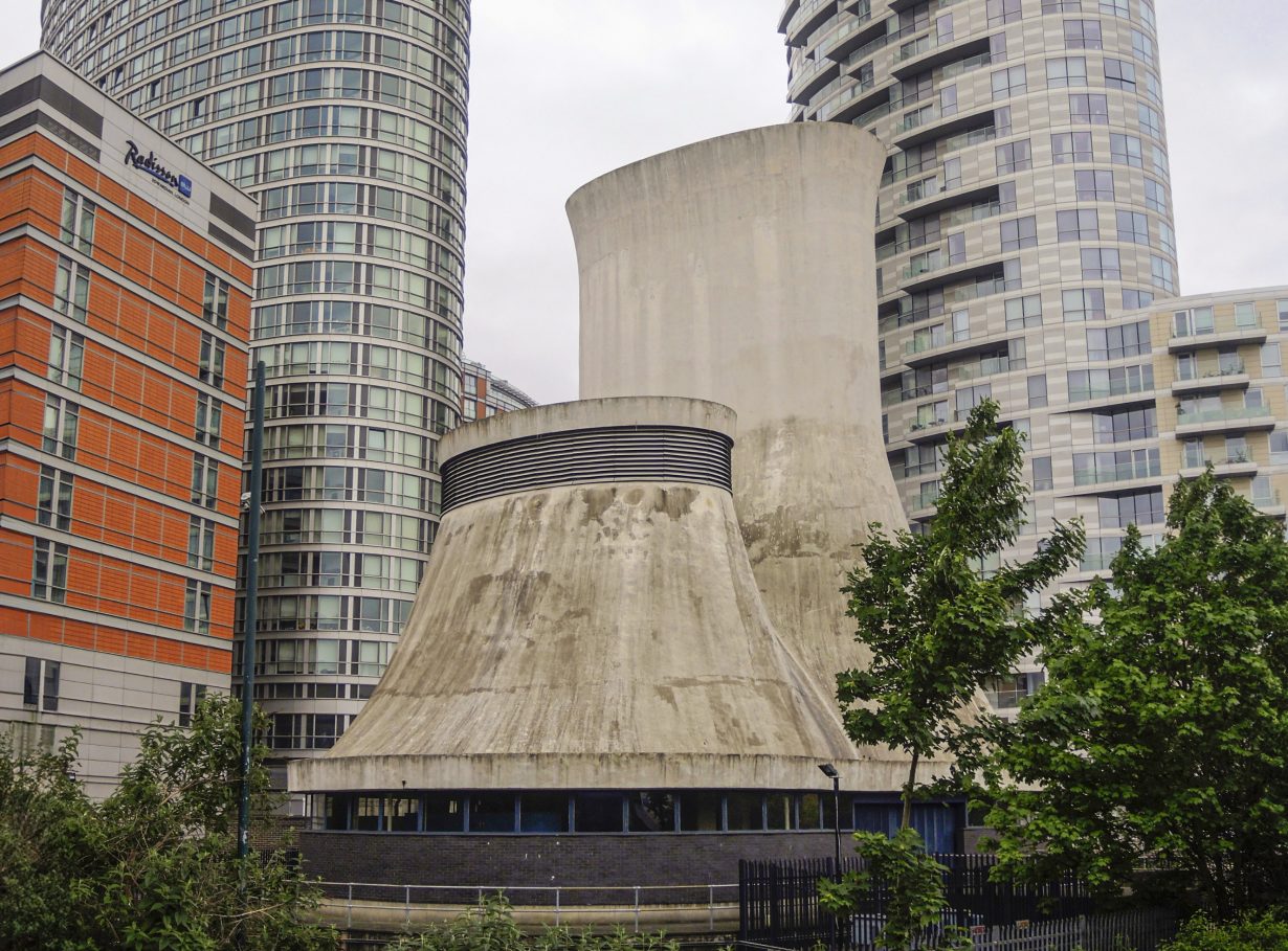 A shaft surrounded by tall buildings